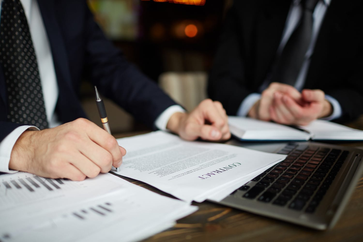 lawyers signing documents