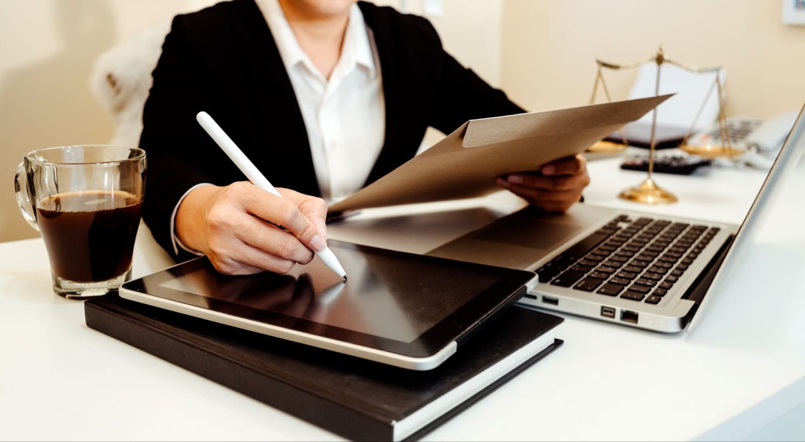 Businessman using a tablet to write