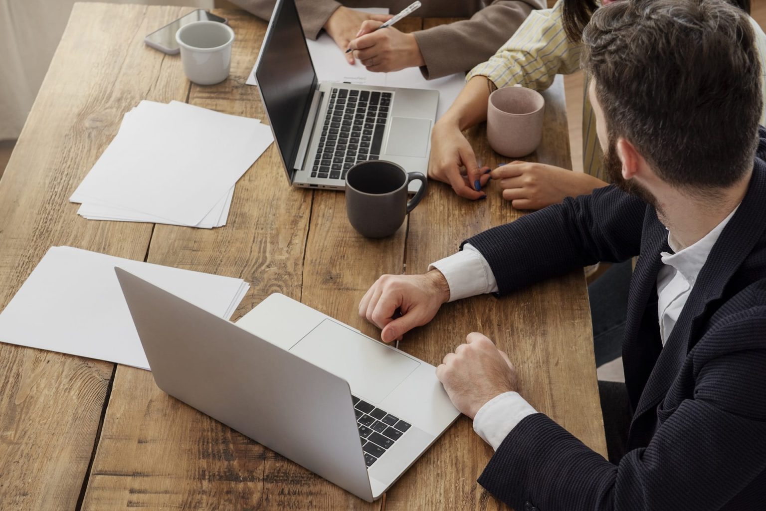 Colleagues using laptops