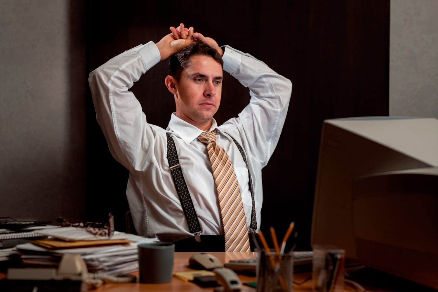 a frustrated lawyer sitting at his desk