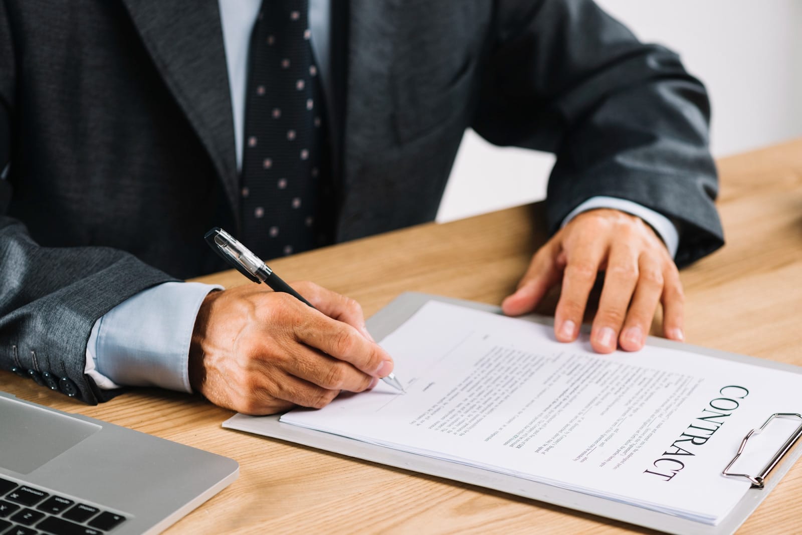 lawyer signing a contract