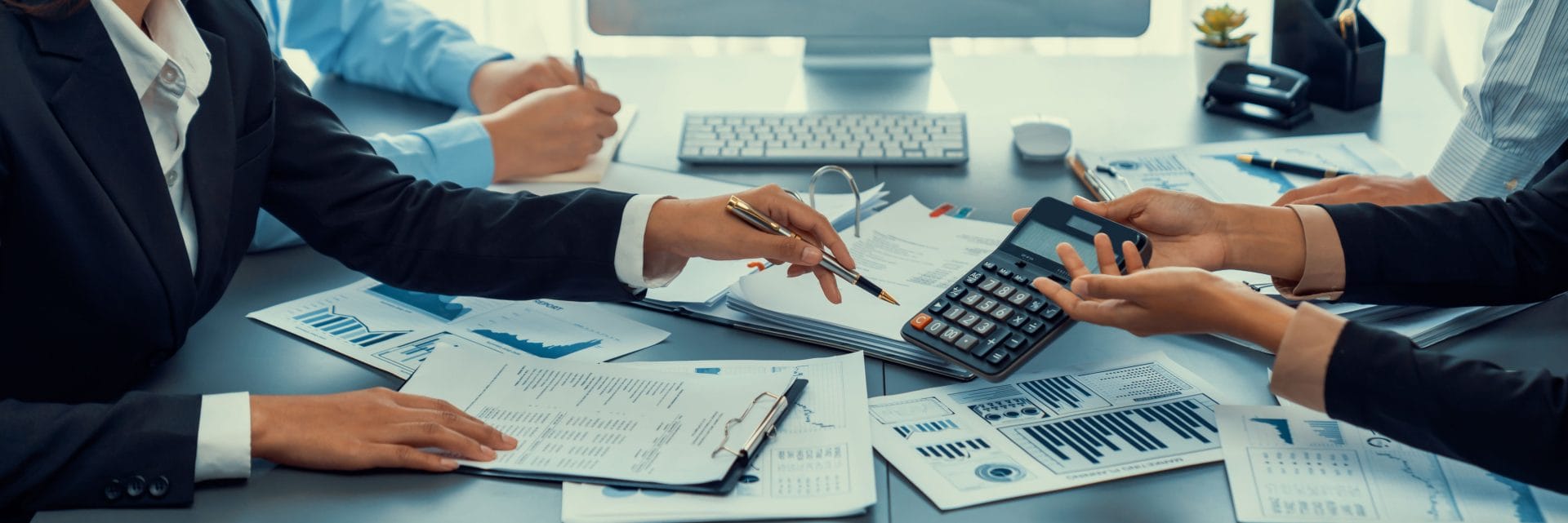 businessmen using a calculator