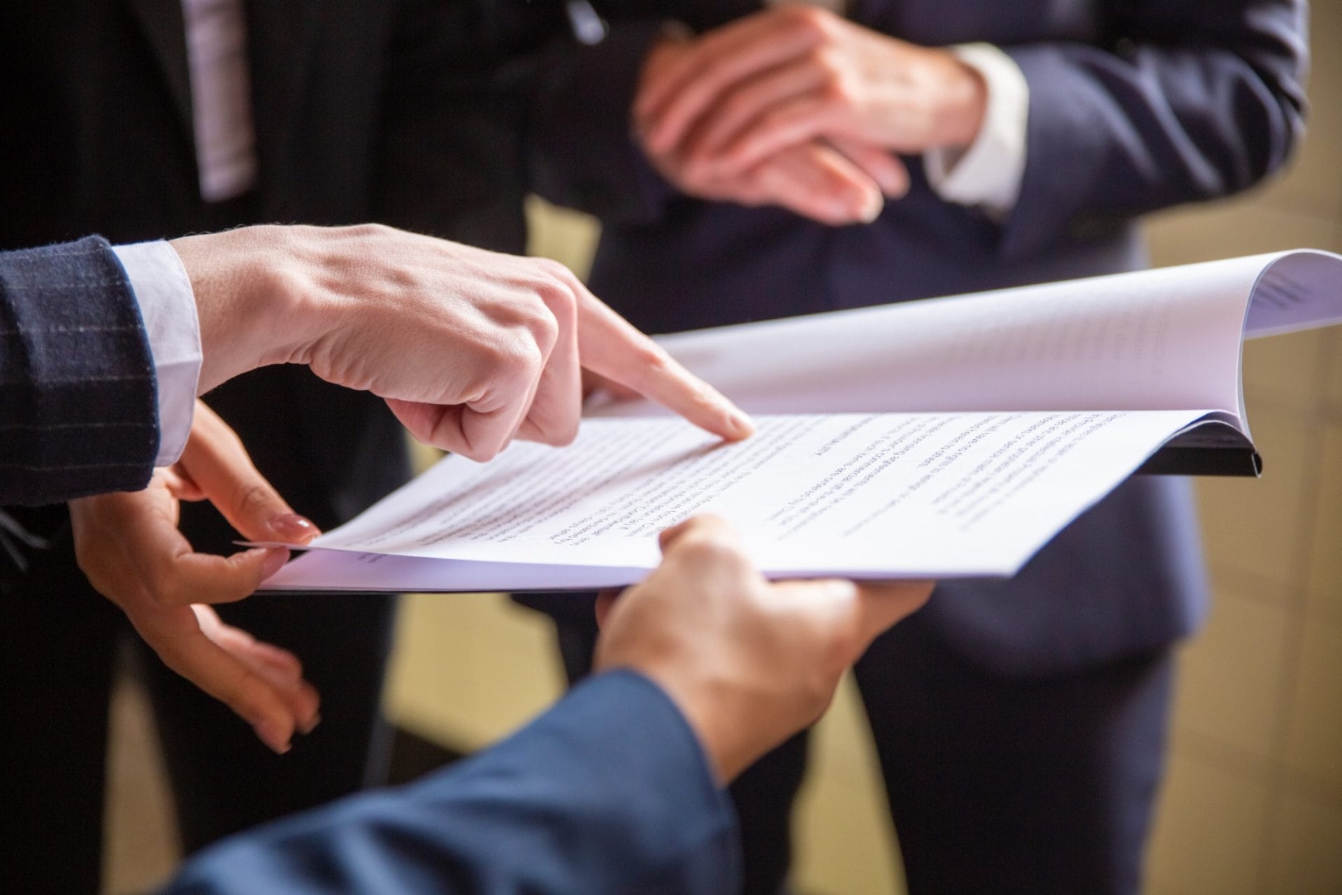 A group of lawyers going through a document