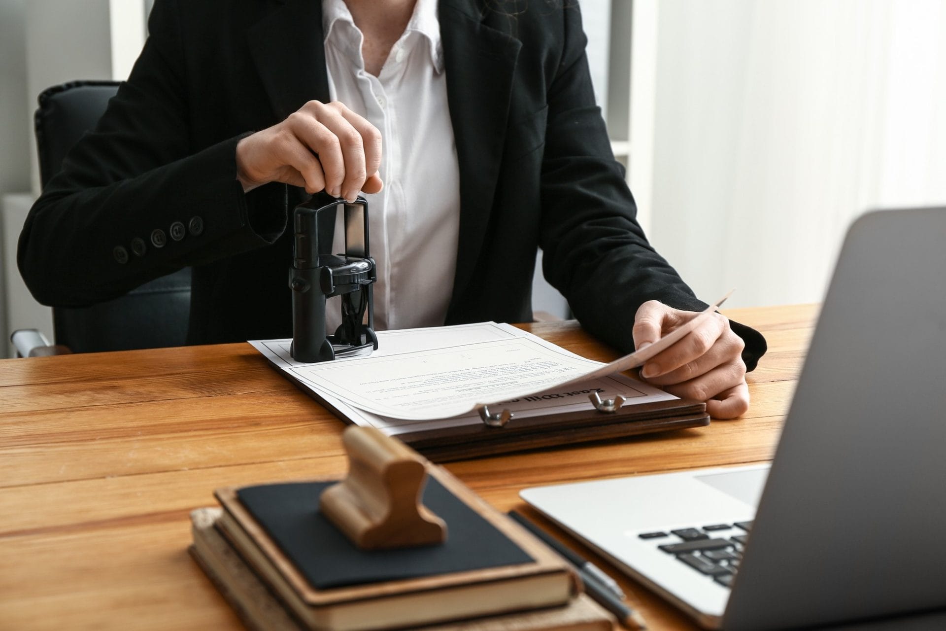 Lawyer putting a stamp on a document