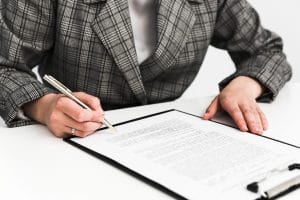 A person signing a contract