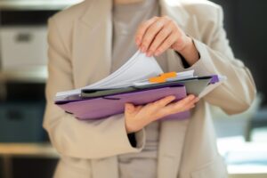 woman holding a documents