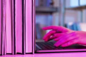 Laptop and documents illustrating ediscovery