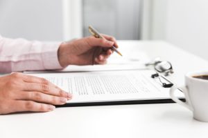 person working with paper documents